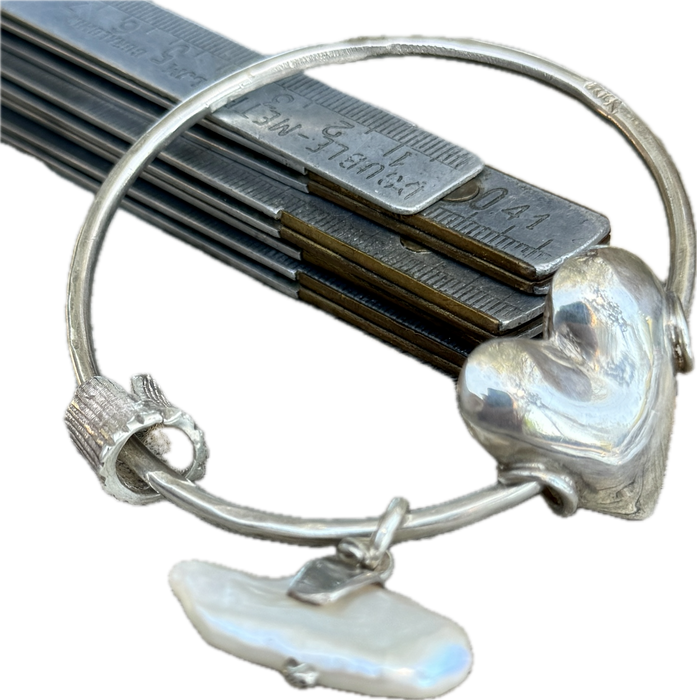 Silver bangle with white pearl and cushion heart