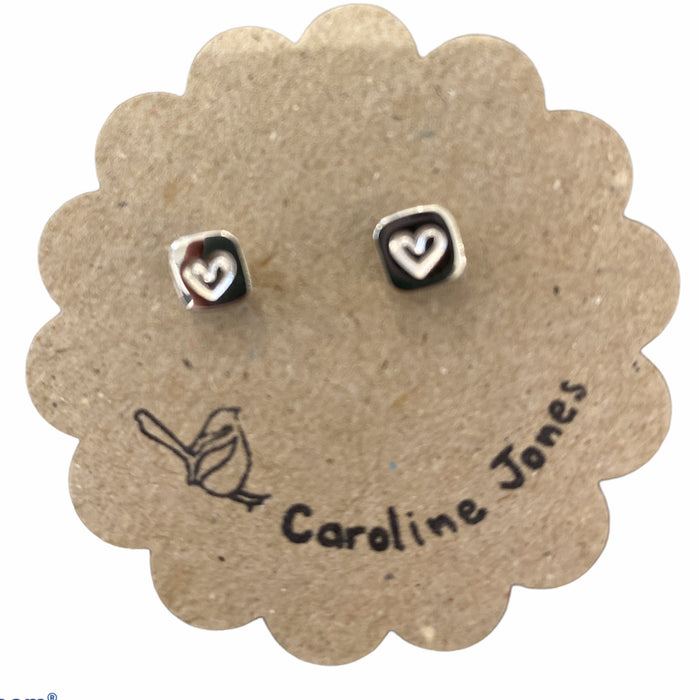 Tiny silver heart stamped studs
