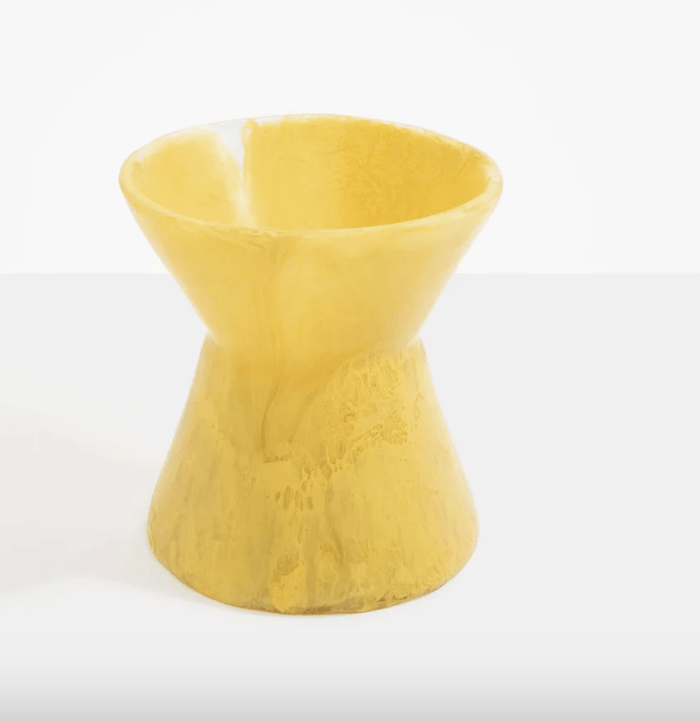 A yellow resin vase by Dinosaur Designs