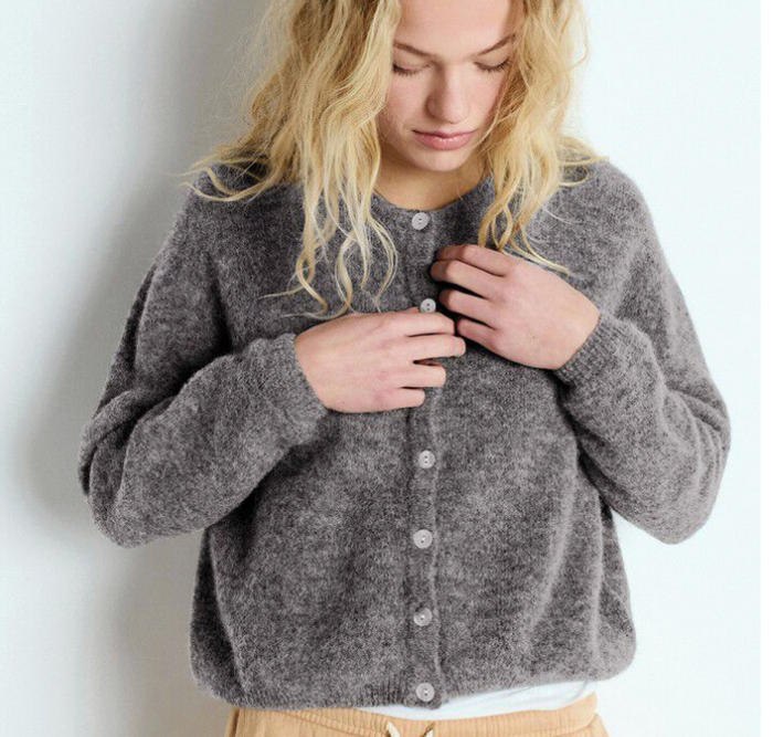 woman wearing grey American vintage knit cardigan