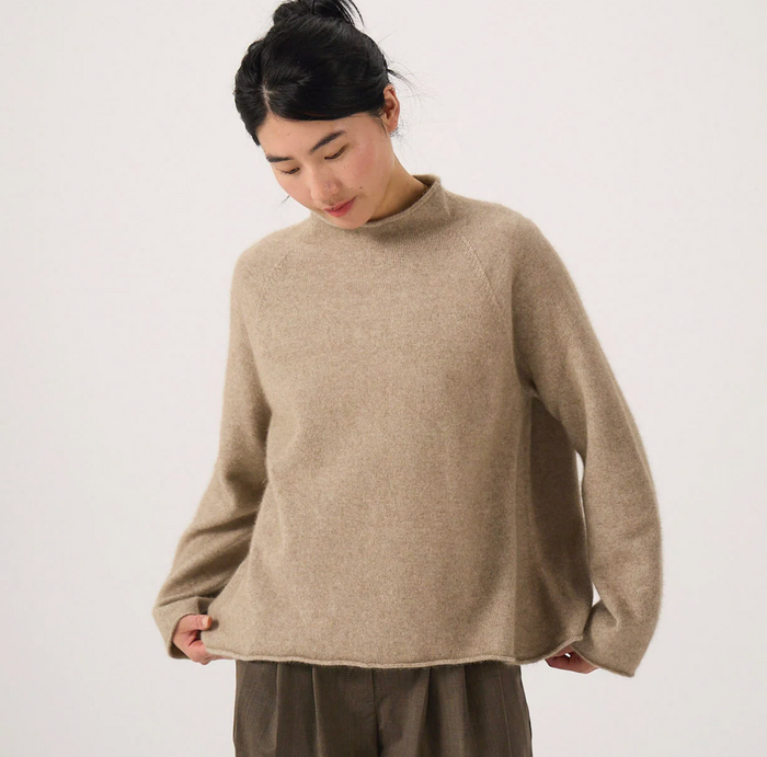 woman wearing grey American vintage knit cardigan