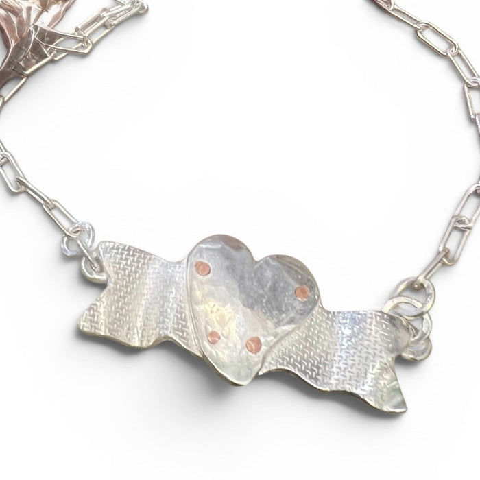 Designs by Flick Flick Pope Mother's Medal necklace, a silver heart on an engraved banner