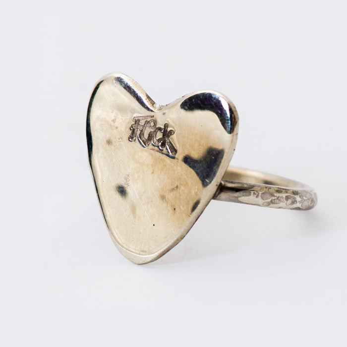 Flick Pope handmade silver heart ring with a stamped Flick signature and a hammered band