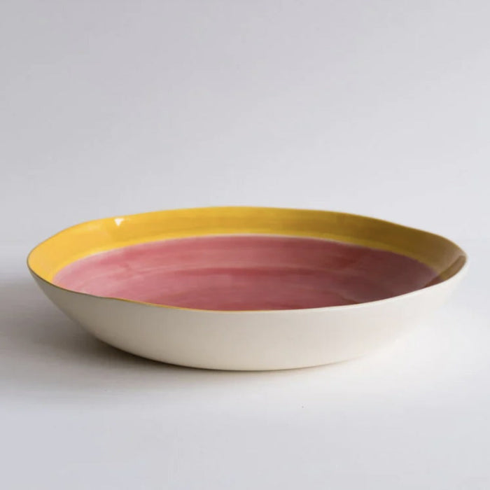 Musango sharing bowl in hand painted ceramic, cream exterior with a yellow rim and dusty pink washed centre