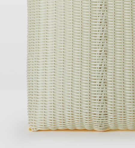 detail of woven material of bag, on a white background