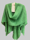 Green textured blanket on a gray surface