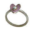 Silver ring with a pink heart-shaped gemstone on a light gray background