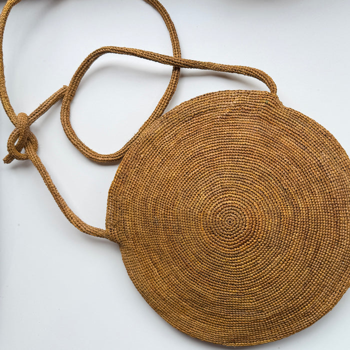 Round mustard coloured crocheted cross body bag | 28 cm