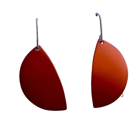 Pair of red teardrop-shaped earrings on a white card with 'Bourne' branding.