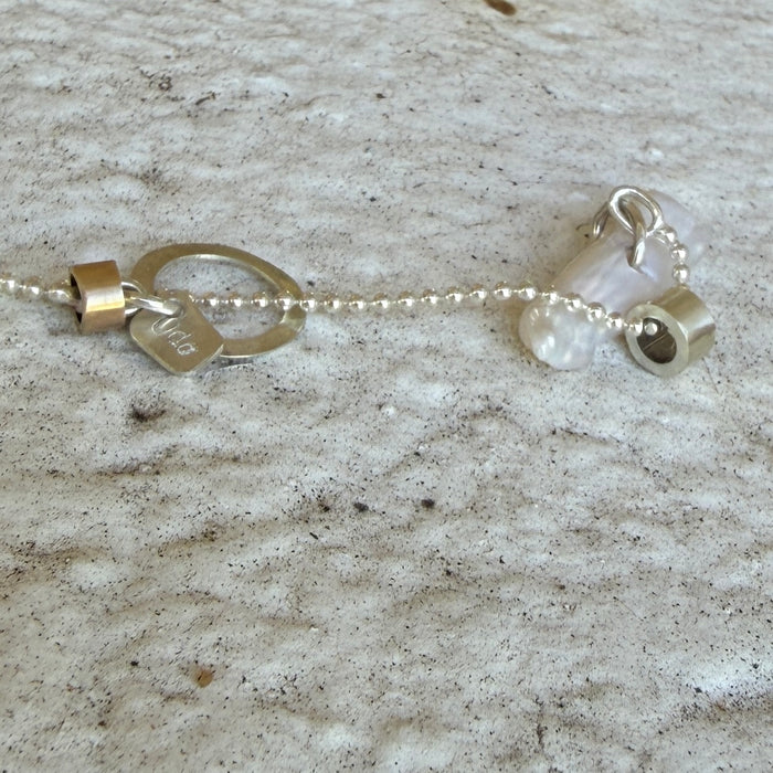 Kiss Kiss pearl charm necklace