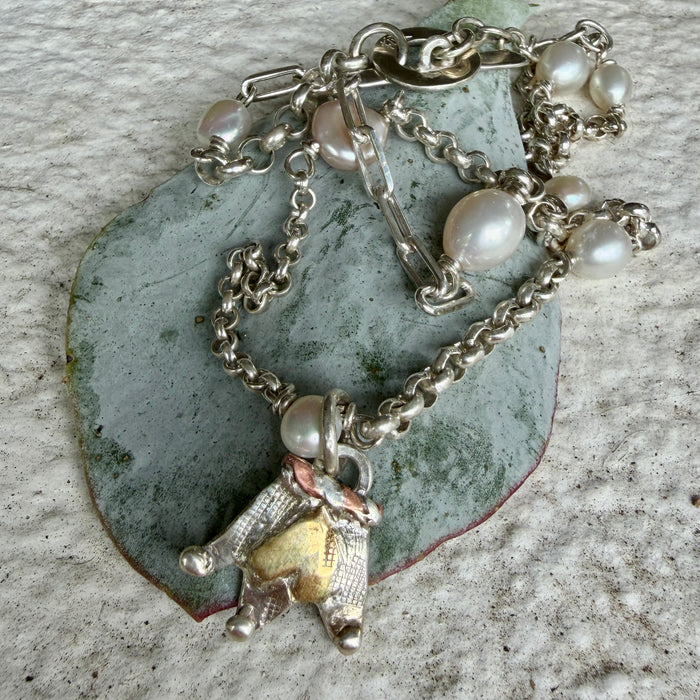 Silver and pearl necklace with silver crown charm