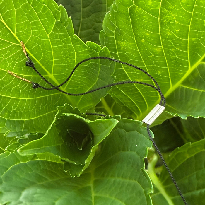 Simple black silk necklace with charms
