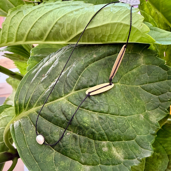 Simple black silk necklace with charms