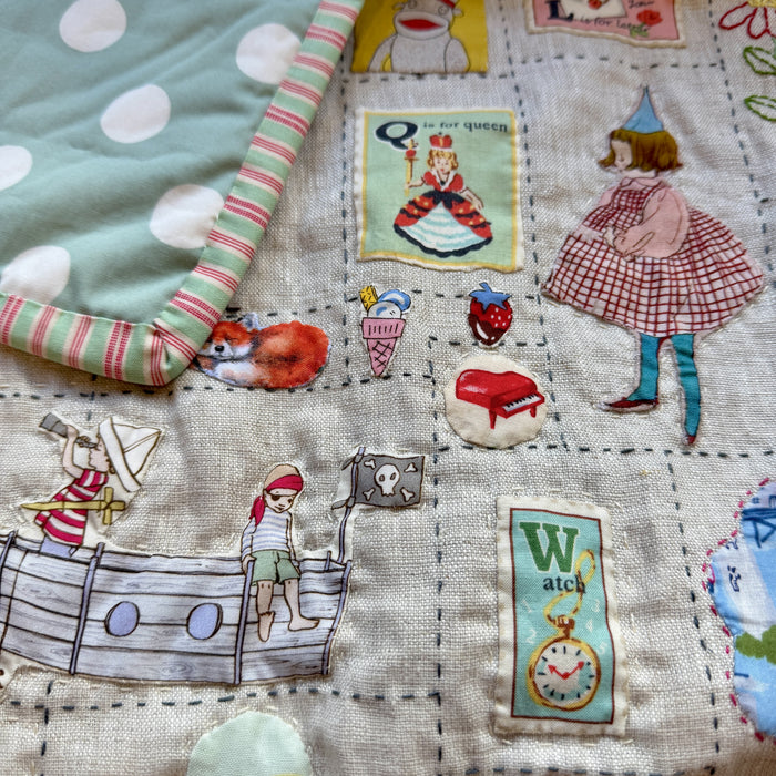 Hand stitched baby quilt in linen and cotton