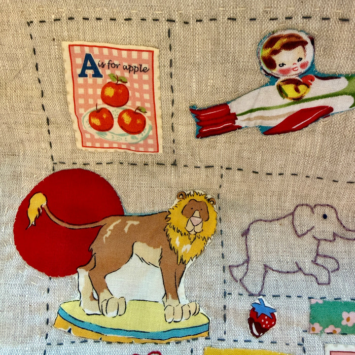 Hand stitched baby quilt in linen and cotton