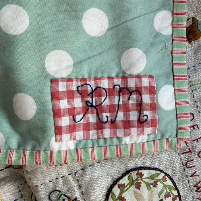 Hand stitched baby quilt in linen and cotton