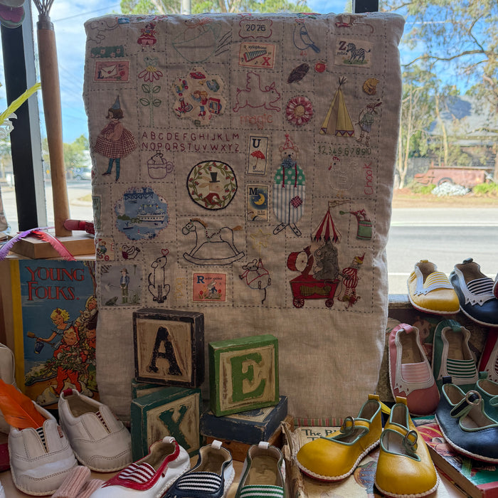 Hand stitched baby quilt in linen and cotton