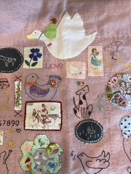 Rose pink hand stitched   baby  quilt