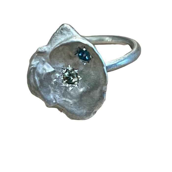 Silver keshi ring with topaz and sapphires