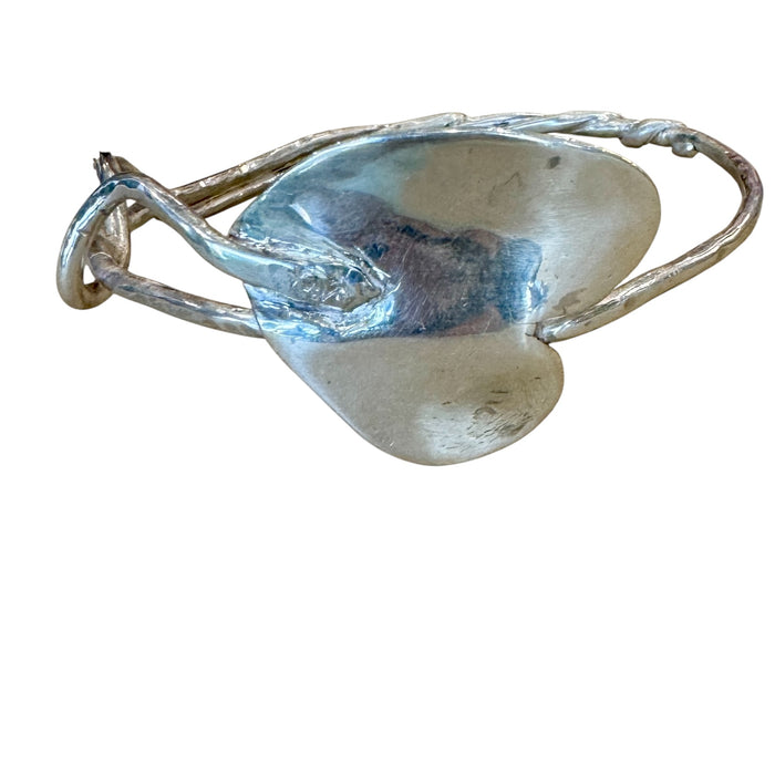 Silver heart bangle with a twist
