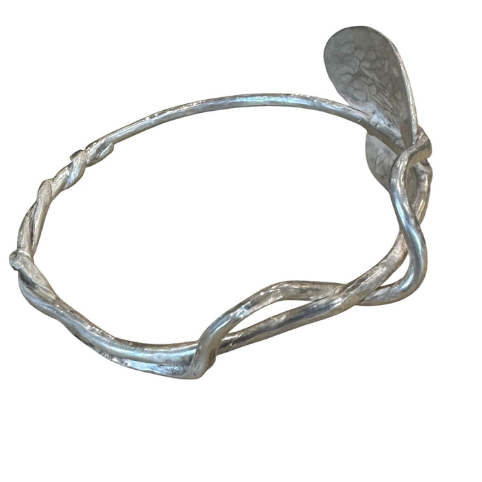 Silver heart bangle with a twist