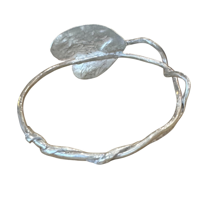 Silver heart bangle with a twist