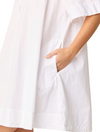 White dress with a pocket on a plain background
