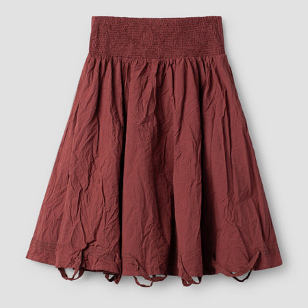 Aili cotton pinafore dress by Ewa i Walla in terracotta, A-line midi with front patch pockets, laid flat