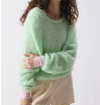 Model wearing the American Vintage Nib fluffy knit jumper in mint green