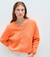 Model wearing the American Vintage Vito fluffy knit cardigan in bright orange