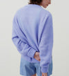 Back view of the American Vintage Vitow alpaca crew knit in iris on model