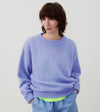 Model wearing the American Vintage Vitow alpaca crew knit in iris lavender blue