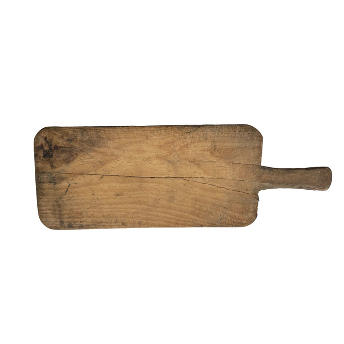 Long rectangular vintage wooden bread board with a paddle handle, showing a natural split along the grain