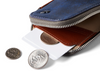 Bellroy Card Pocket wallet in ocean blue, open with cards and coins