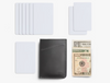 Bellroy Card Sleeve wallet in black, laid out with the cards and notes it holds