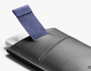 Bellroy Card Sleeve wallet in charcoal/cobalt, pulling cards out with the tab