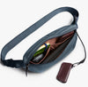 Inside the Bellroy Laneway belt bag in blue steel, with a wallet and keys