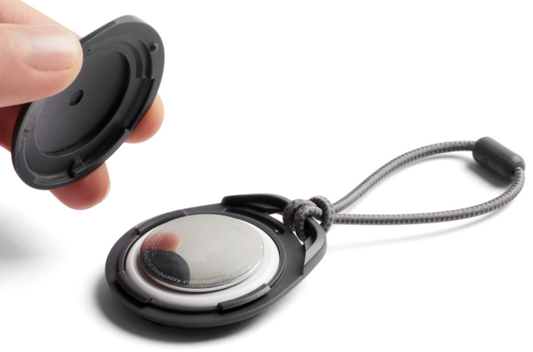 Inserting an Apple AirTag into the back of the Bellroy leather AirTag case