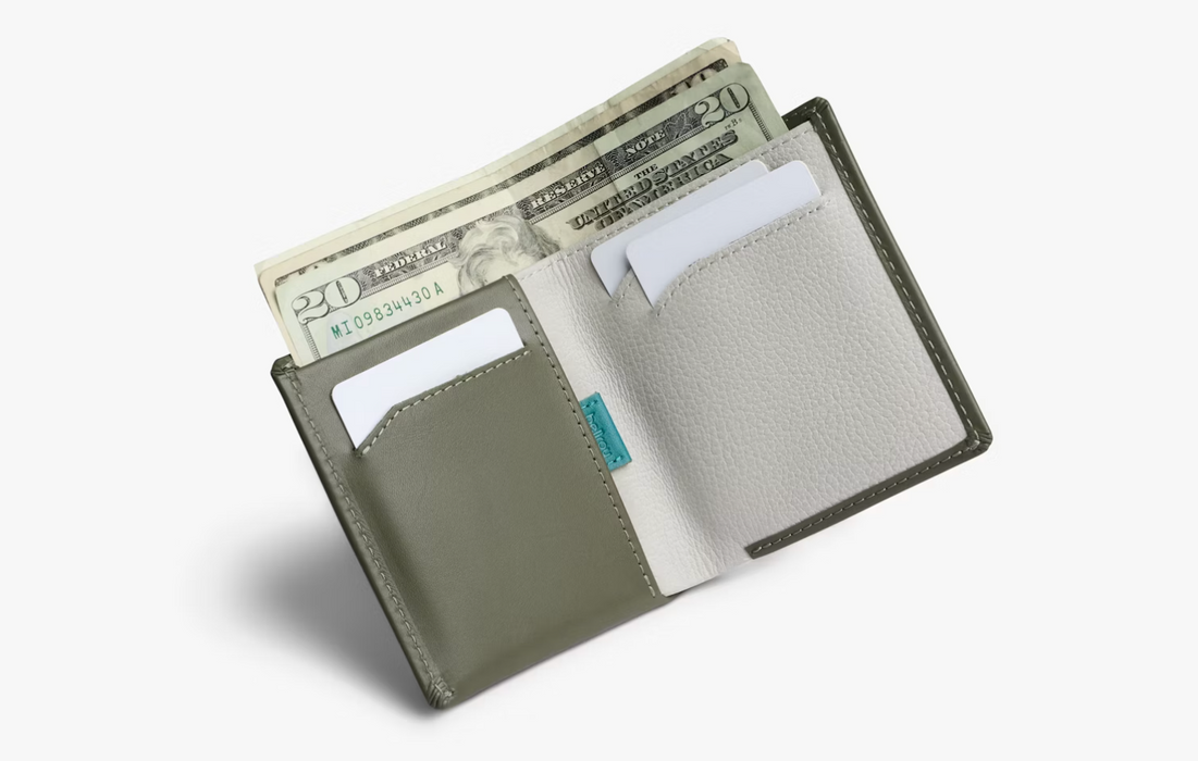 Inside the Bellroy Note Sleeve leather wallet in willow, with notes and cards