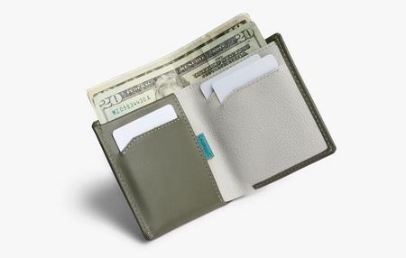 Inside the Bellroy Note Sleeve leather wallet in willow, with notes and cards