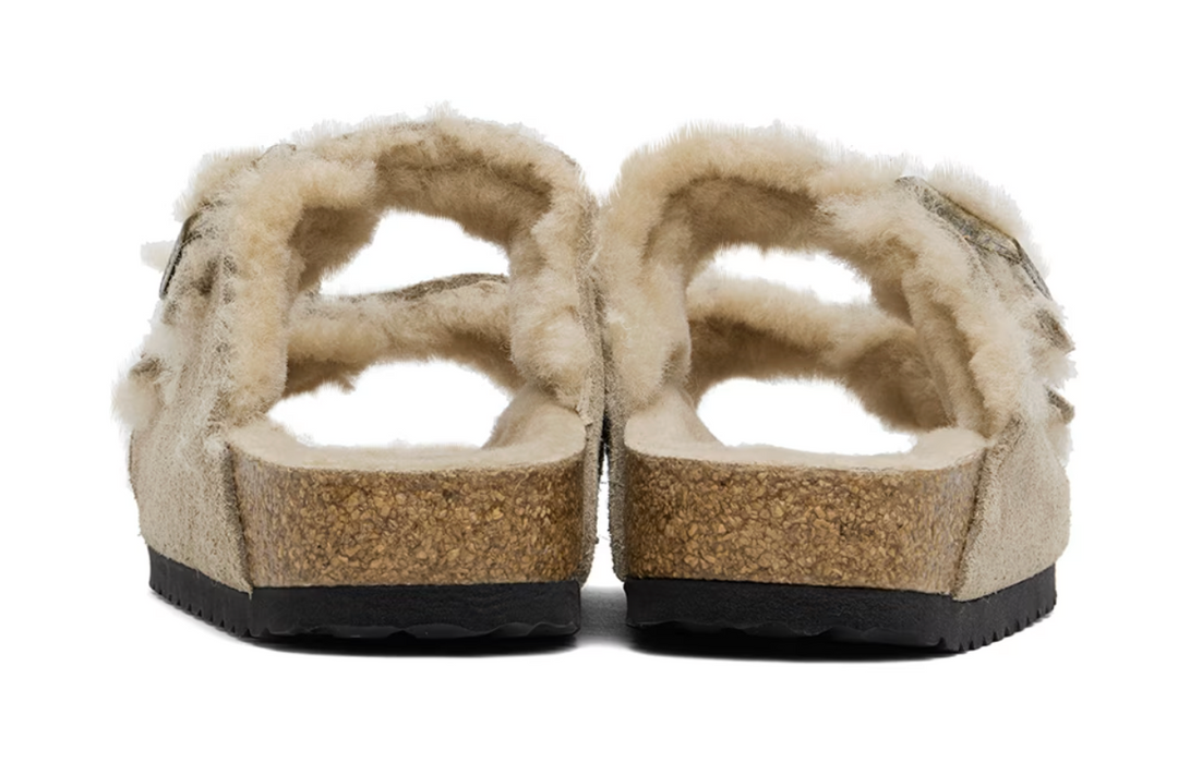 Birkenstock Arizona shearling sandal in taupe suede, front view showing the fluffy lining