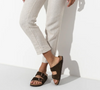 Birkenstock Arizona soft footbed sandal in mocha suede, worn with cream trousers