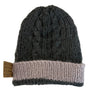 Carrin Rolley hand knitted cable beanie in bottle green with taupe trim