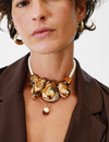 Dinosaur Designs Boulder rock necklace worn by a model with gold earrings