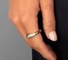 Dinosaur Designs Horn ring in sandy pearl marbled resin worn on the hand