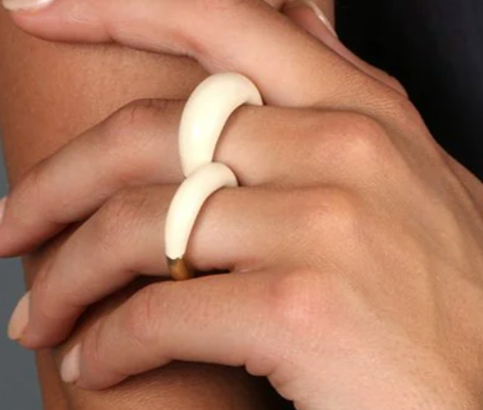Dinosaur Designs Horn rings in cream resin worn on two fingers