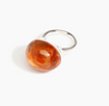 Dinosaur Designs Round watercolour ring in clear strawberry resin, side view