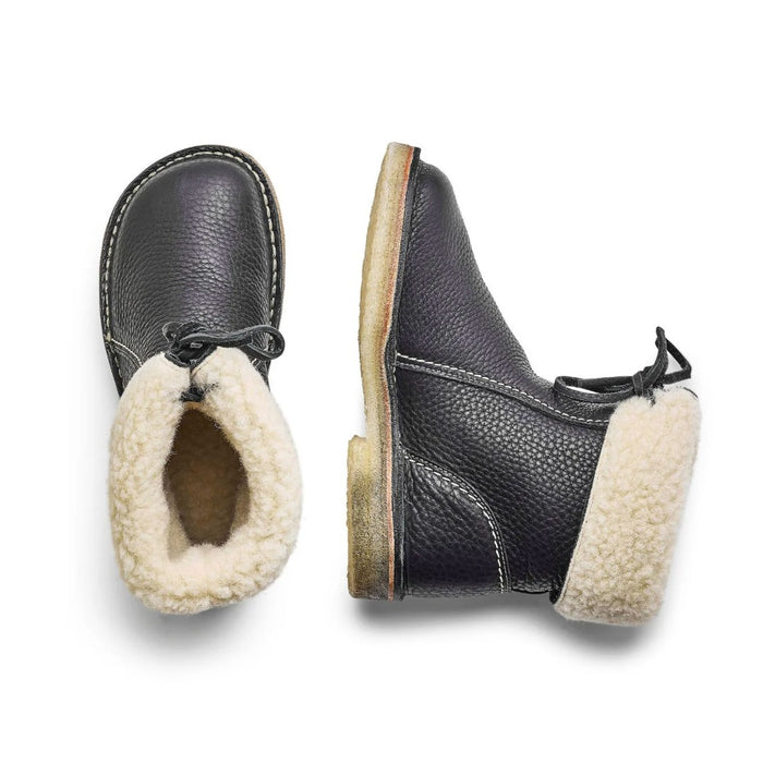 Pair of Duckfeet Arhus shearling lined boots in black, top and side view showing sheepskin lining