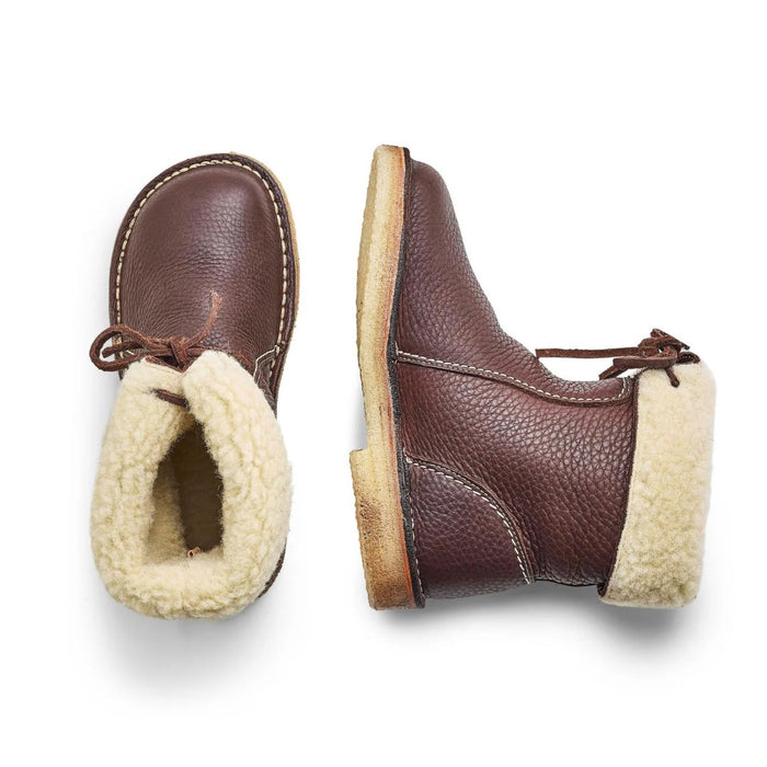 Pair of Duckfeet Arhus shearling lined boots in brown, top and side view showing sheepskin lining