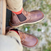 Duckfeet Roskilde brown leather chelsea boots worn with chinos and red socks, overhead view